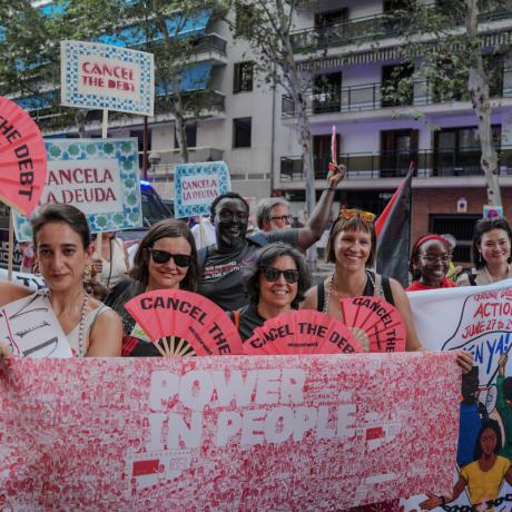 Thousands of activists take to the streets demanding urgent debt cancellation ahead of global summit